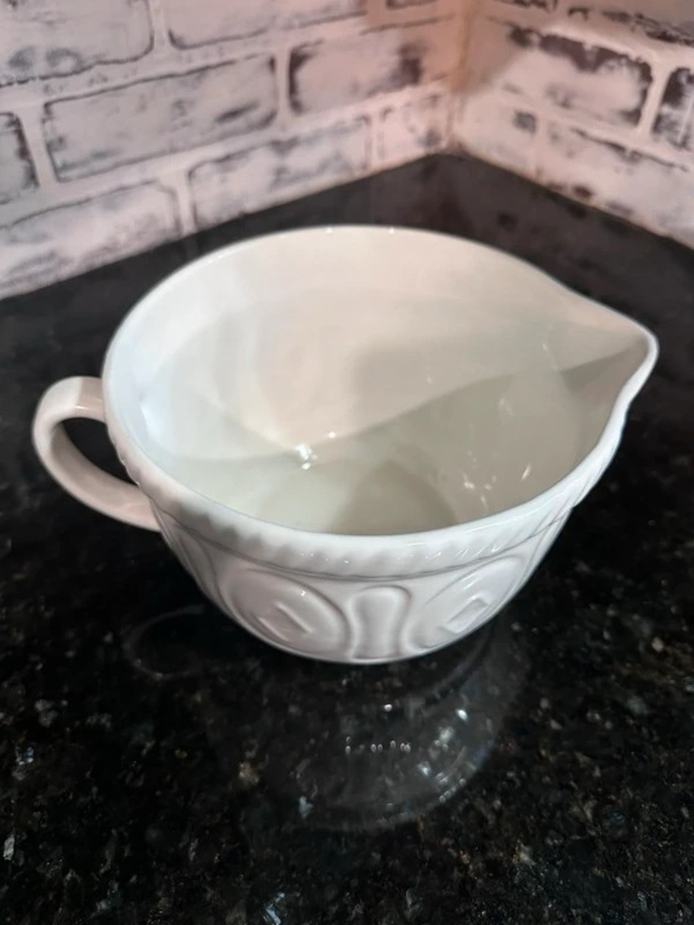 White Ceramic Sauce Pourer with Decorative Relief
